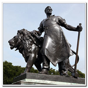 greek hero bronze statue with lion